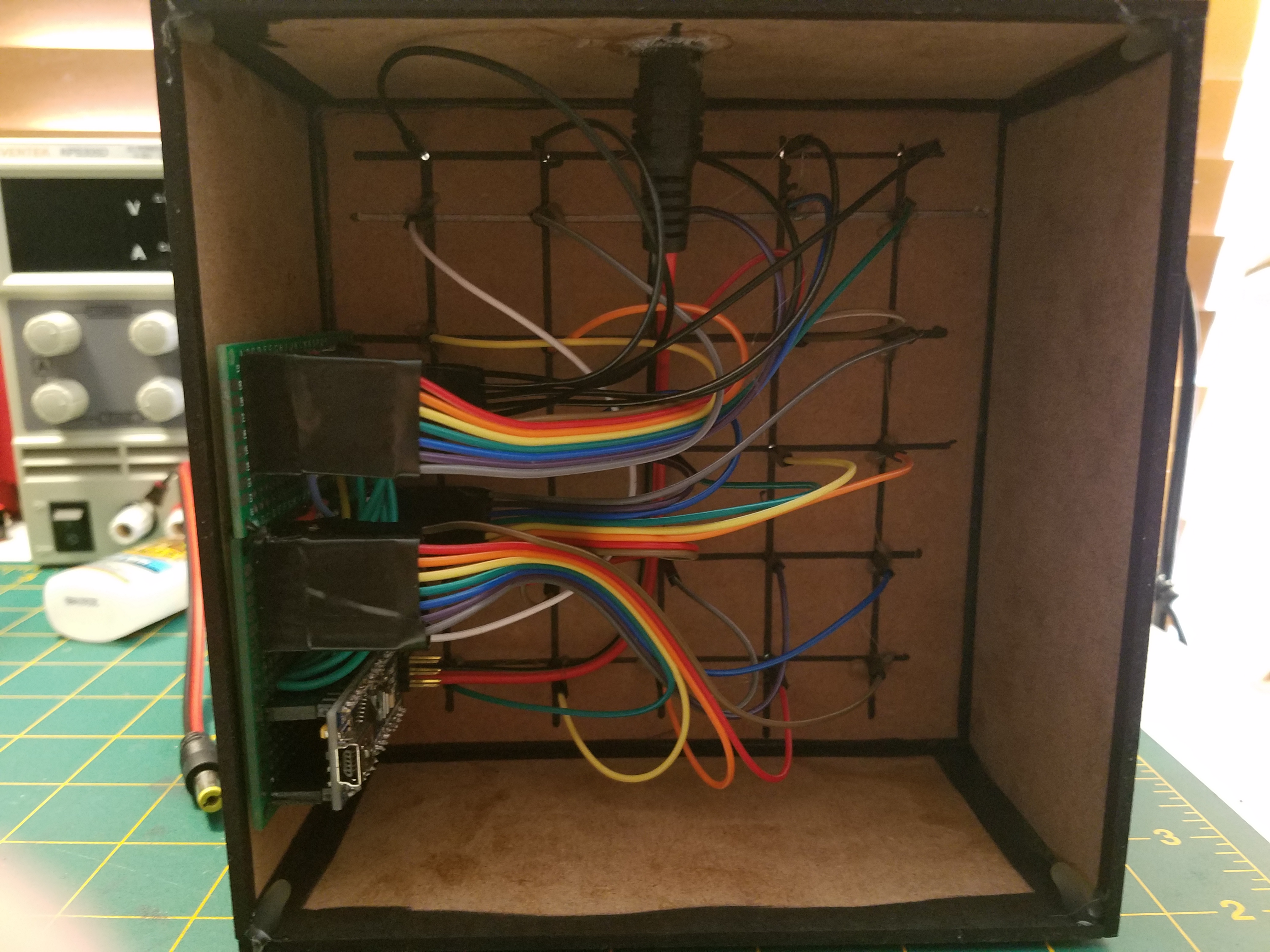 The MDF case that holds the cube contains the board and all the wiring